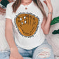 a woman sitting on a couch wearing a baseball mitt t - shirt