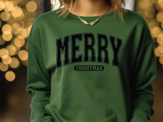 a woman wearing a green merry christmas sweatshirt