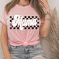 a woman wearing a pink shirt with a black and white checkered design