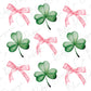 four leaf clovers with pink bows on a white background
