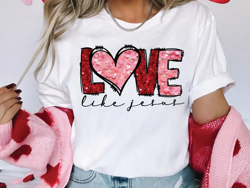 a woman wearing a t - shirt that says love is in the air