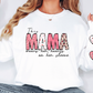 a woman wearing a white shirt with the word mama on it