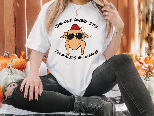 a woman wearing a t - shirt that says the one where it's thanksgiving