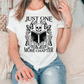 a woman sitting on a couch wearing a t - shirt that says just one more