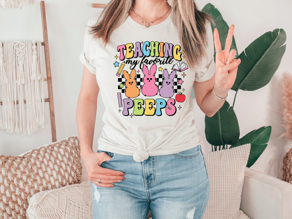 a woman wearing a t - shirt that says teaching is fun pepps