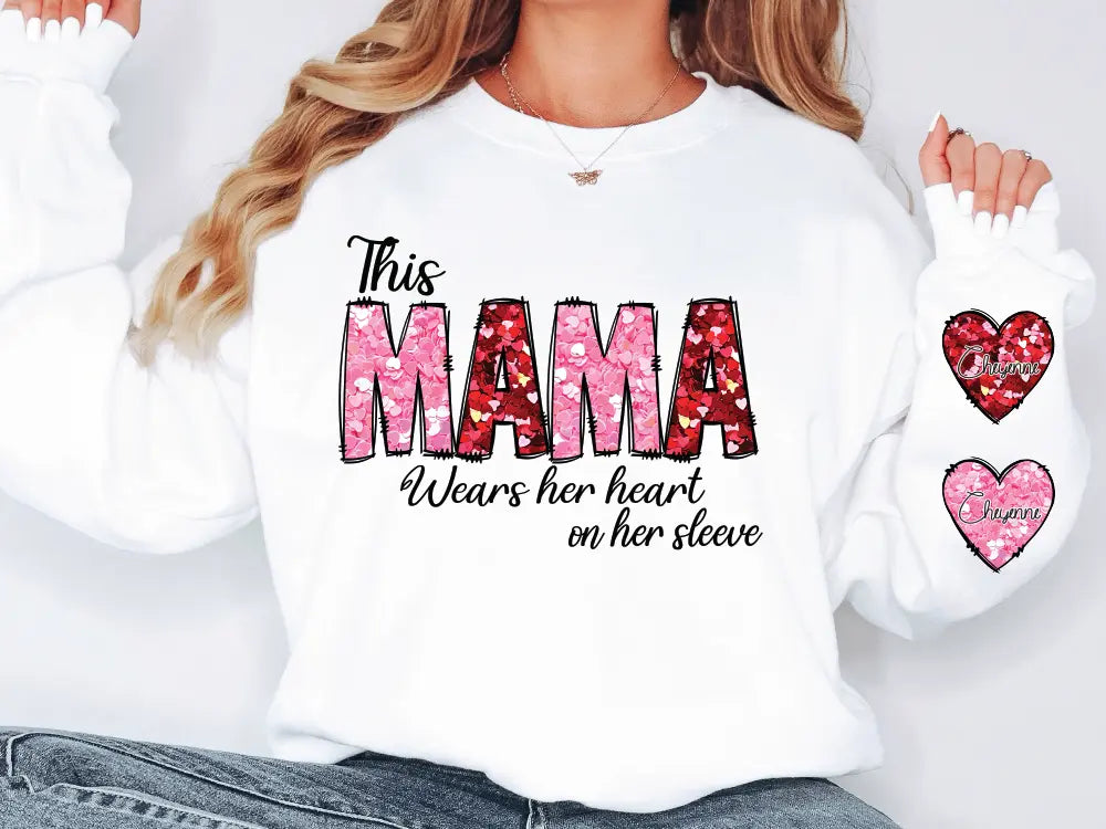 a woman wearing a white shirt with the words mama on it