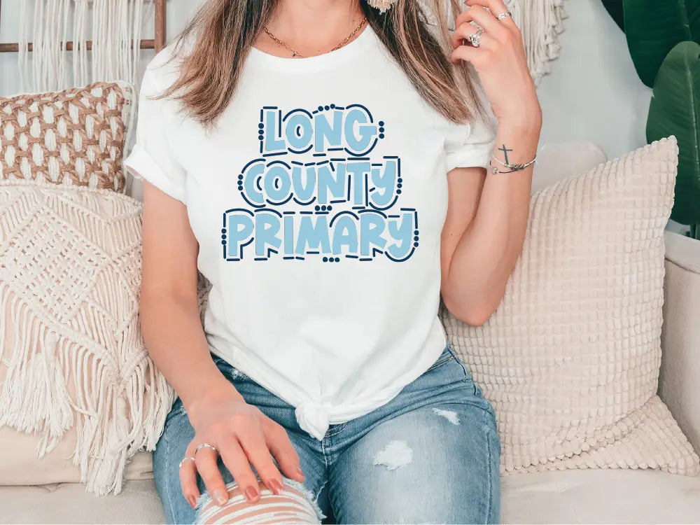 a woman sitting on a couch wearing a t - shirt