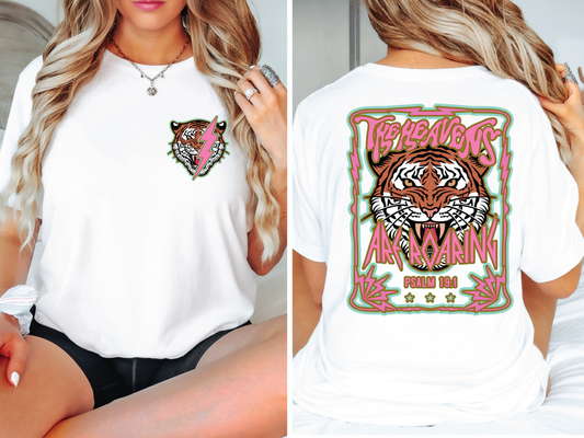 a woman wearing a white shirt with a tiger on it