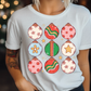 a woman wearing a t - shirt with ornaments on it