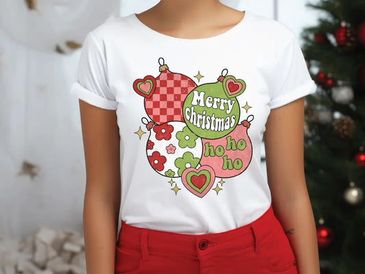 a woman wearing a white t - shirt that says merry christmas