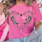 a woman wearing a pink heart shaped t - shirt
